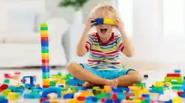 young child playing with blocks