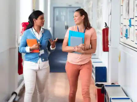 teachers walking alongside each other