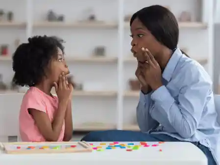 speech language pathologist working with young child