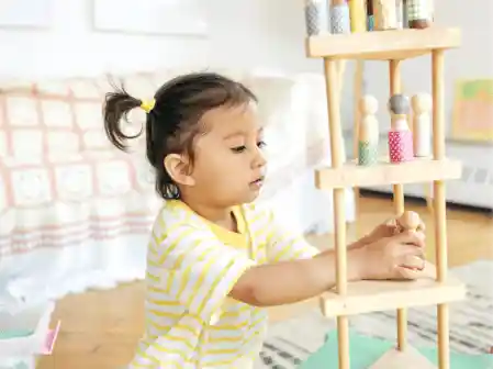 child playing in classroom