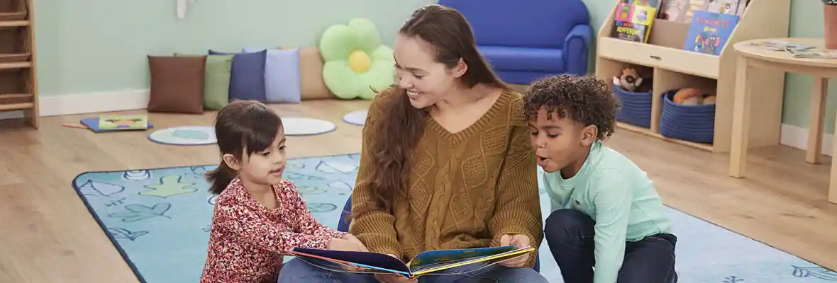 Preschool teacher & children reading
