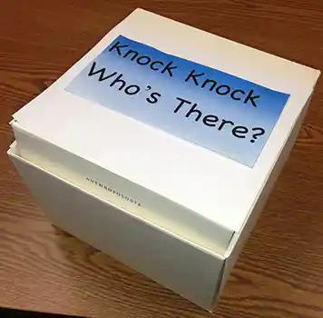 White box with Knock Knock Whose There written on it