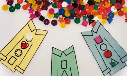 Bright buttons and Pete the Cat shirt activity on white tray