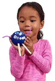 Preschool girl holding silly dough creature