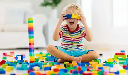 preschool child playing with blocks