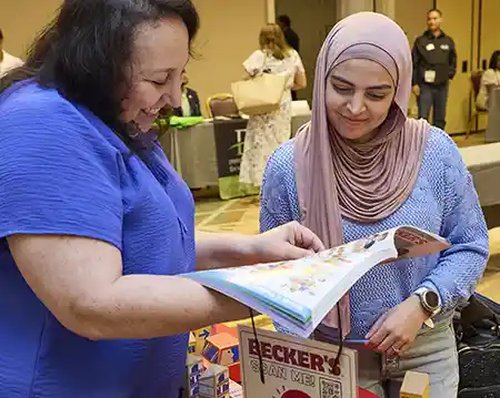 Becker&rsquo;s Sales Specialist showing catalog and sharing product expertise