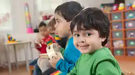 young children playing instruments in a classroom