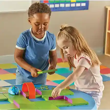 Kids playing with robot mouse