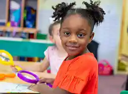 Child using Jumbo Magnifier